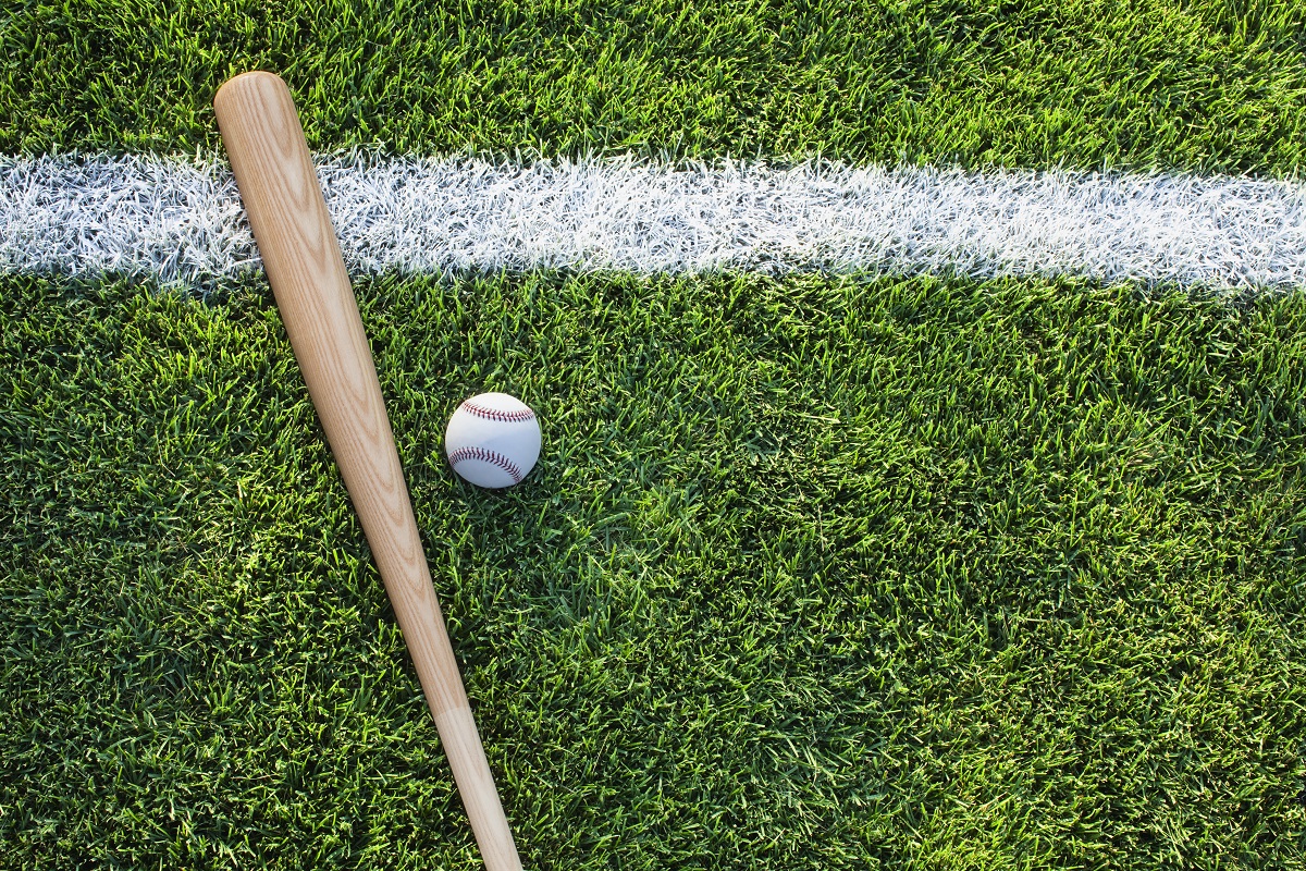 Baseball and bat on a field