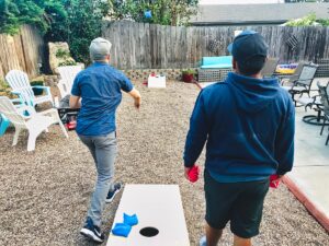 Friends enjoying a game of bags