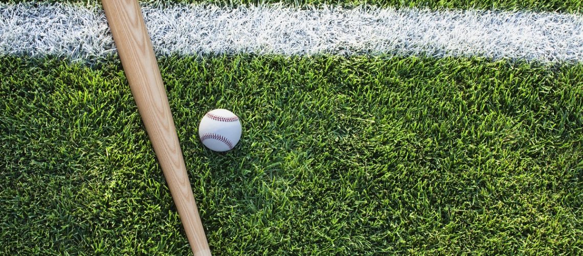 Baseball and bat on a field
