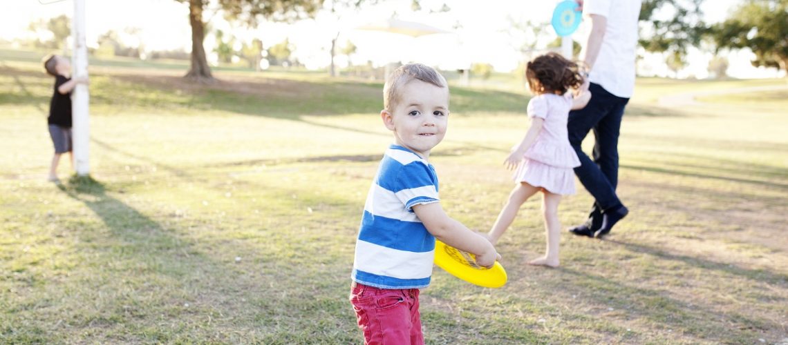 Family playing with frisbee