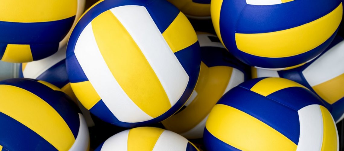 Many volleyballs.