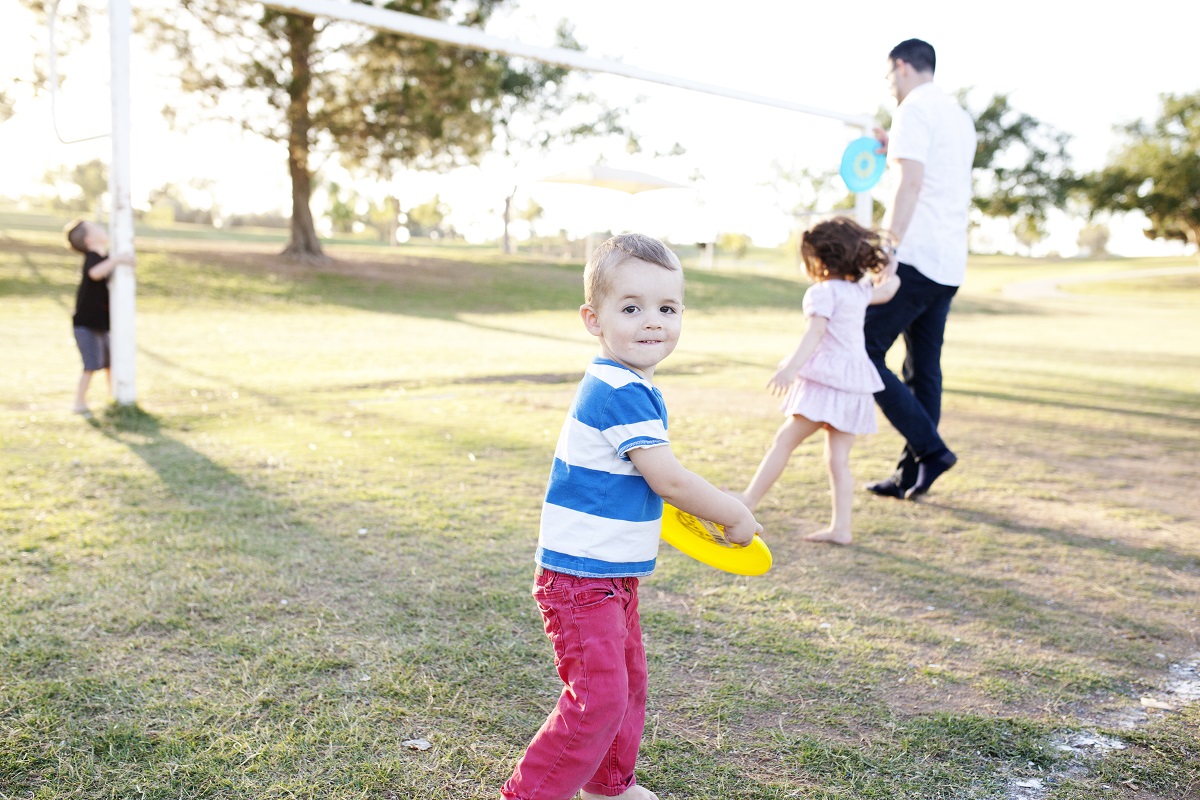 Family playing with frisbee