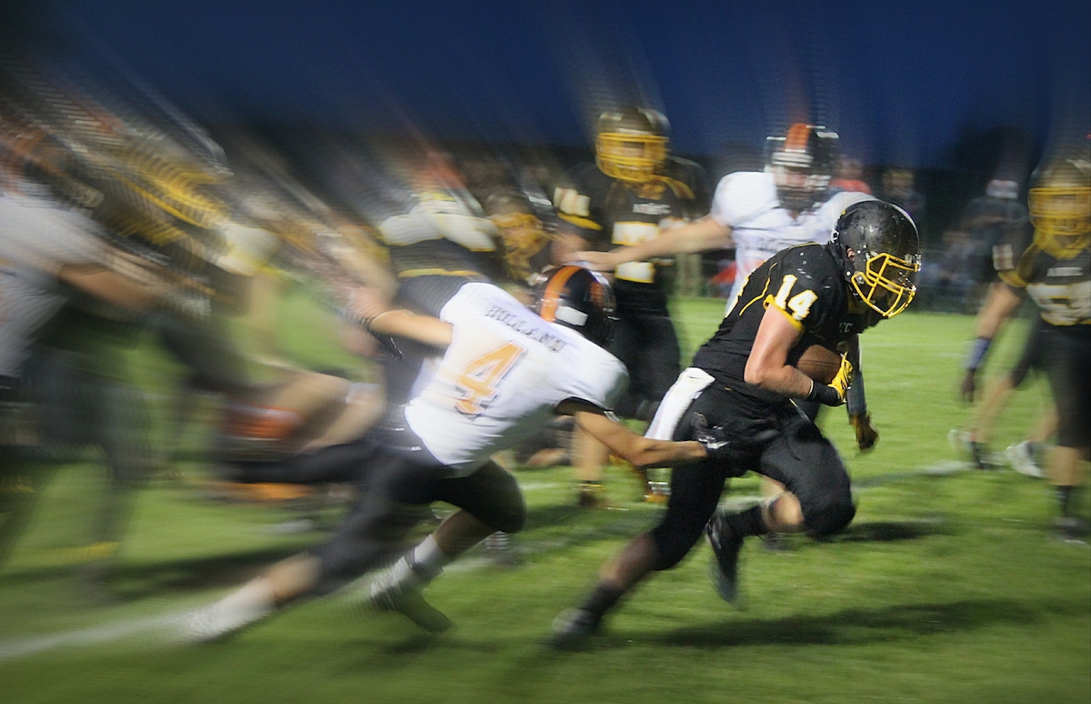 Image of football players with motion blur